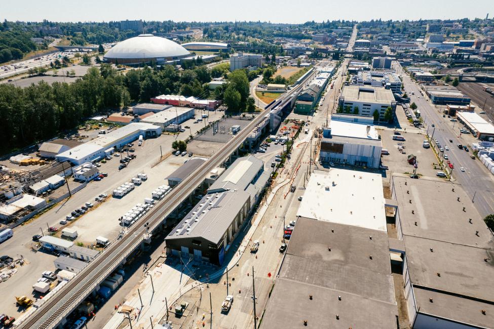 A drone shot of the new OMF in Tacoma, with the Tacoma Dome in the background.