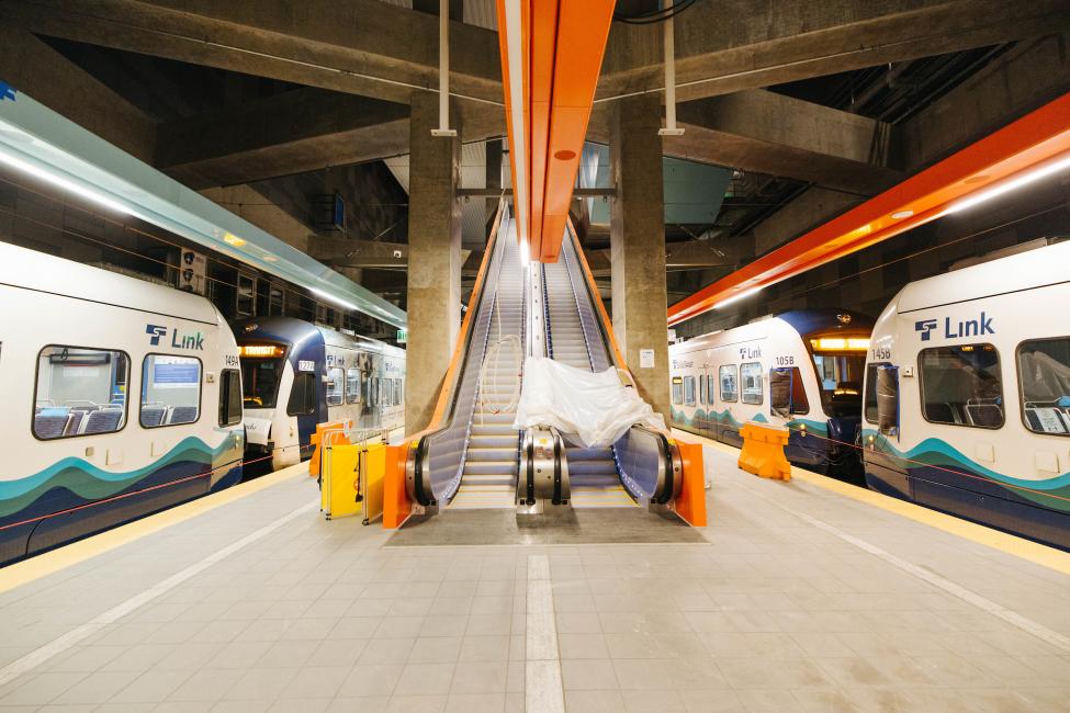 The view from the U District Station platform with trains on both sides of the platform during testing. 