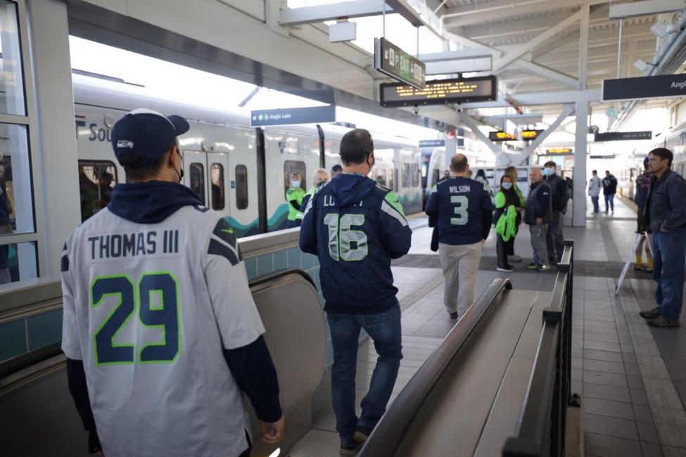 Seahawks fans board the train at Northgate Station.