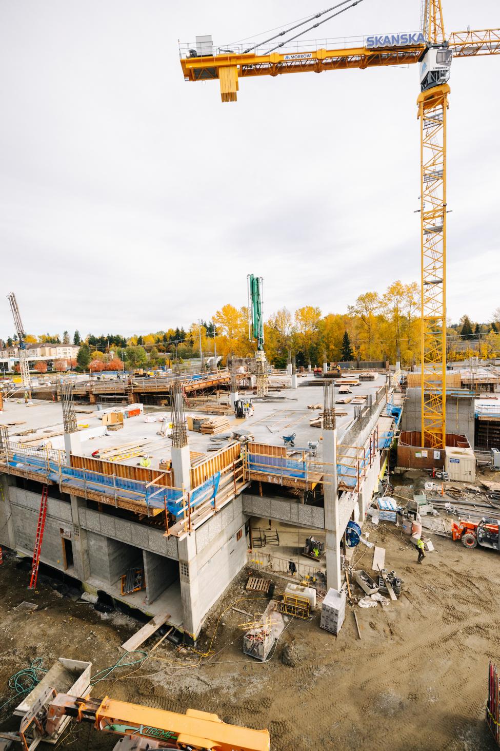 A crane is next to a structure under construction.