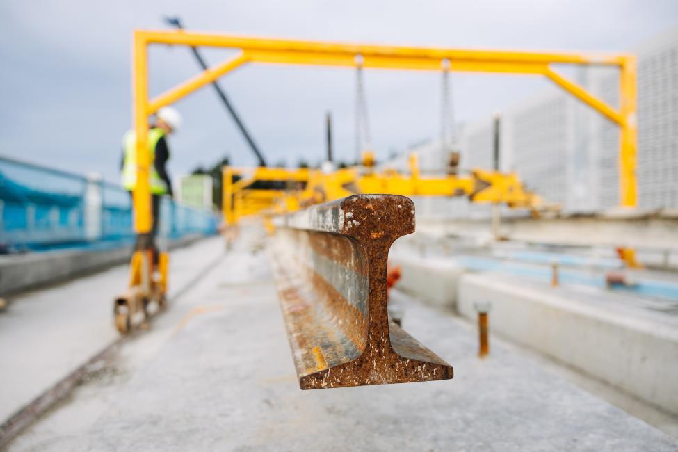 A closeup of rail on a construction site.