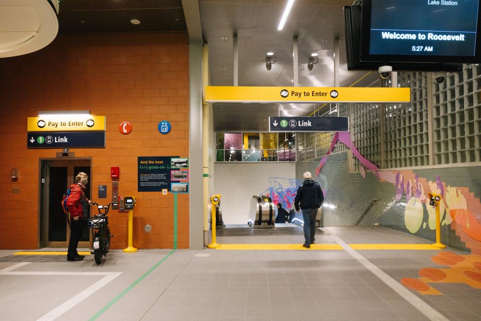 Yellow lines mark the fare paid zone at Roosevelt Station.