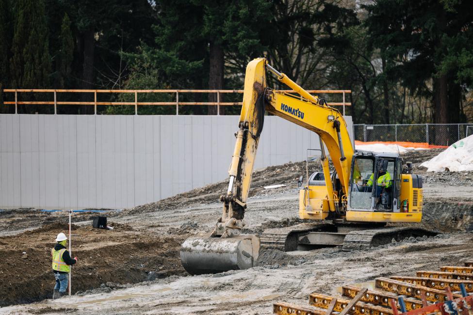 An excavator at work on a construction site.
