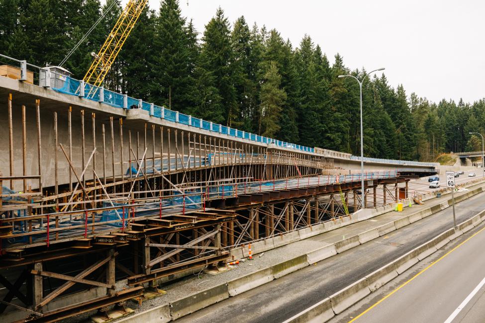 Looking north over I-5 at the bridge and surrounding falsework.