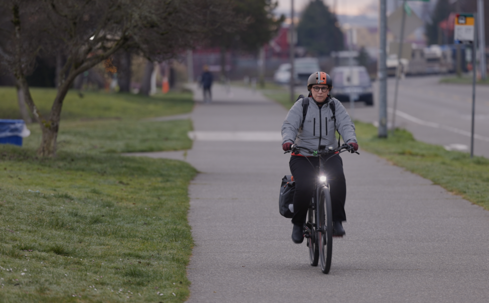 Brooke Belman rides an electric bike.