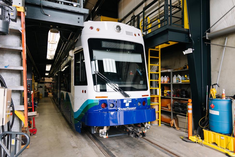 A new light rail vehicle pulls into the OMF in Tacoma.