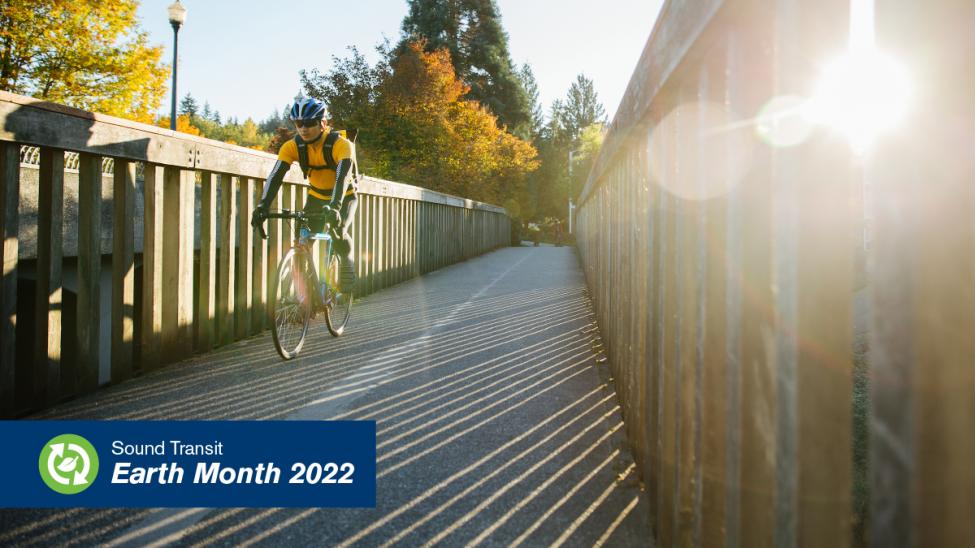 A bicyclist crosses a bridge. 