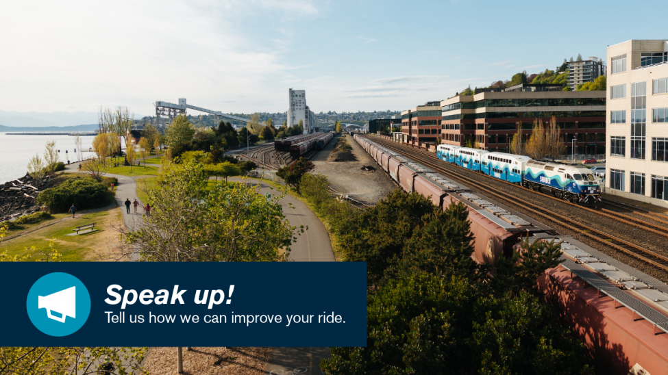 A Sounder commuter rail train heading into Seattle along the waterfront.