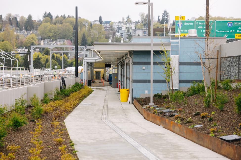 A landscaped path leads to the Judkins Park Station platform.