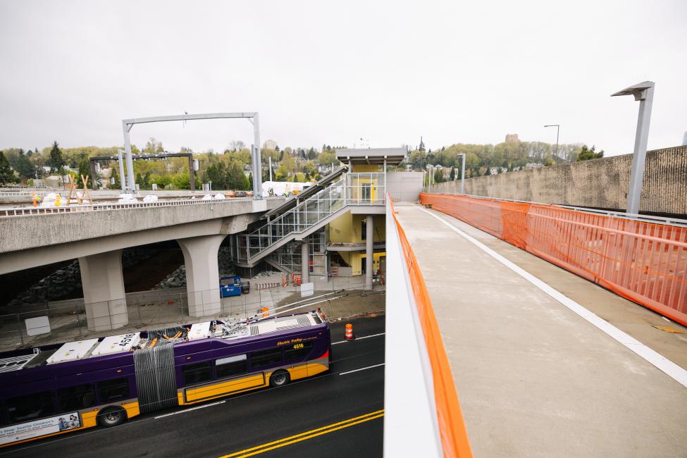 A King County Metro bus passes by the future Judkins Park Station.
