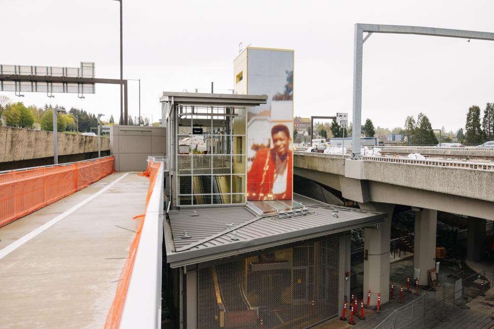 The other entrance of Judkins Park Station, with a mural featuring a young Jimi Hendrix.