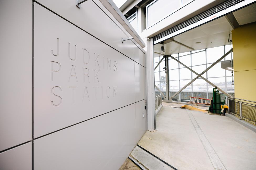 Text inscribed into a wall reads 'Judkins Park Station.'