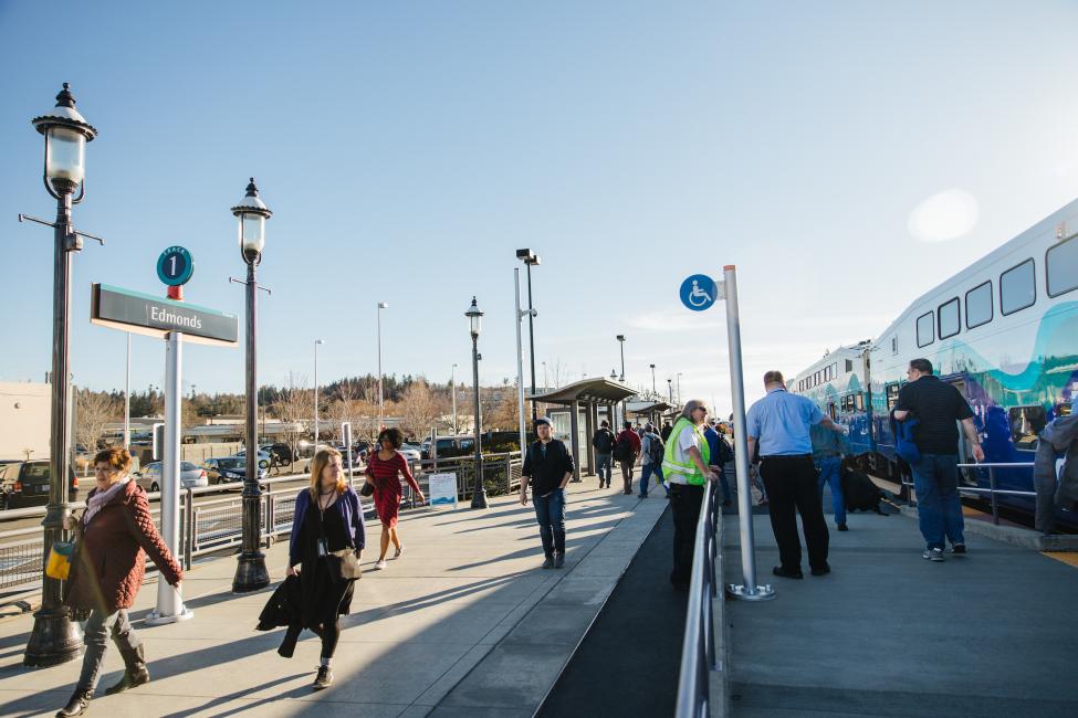 People walk along the platform at the Edmonds Sounder Station.