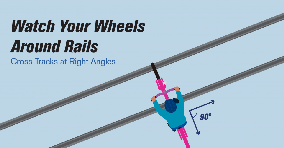 A graphic of a cyclist crossing train tracks at a 90 degree angle. 