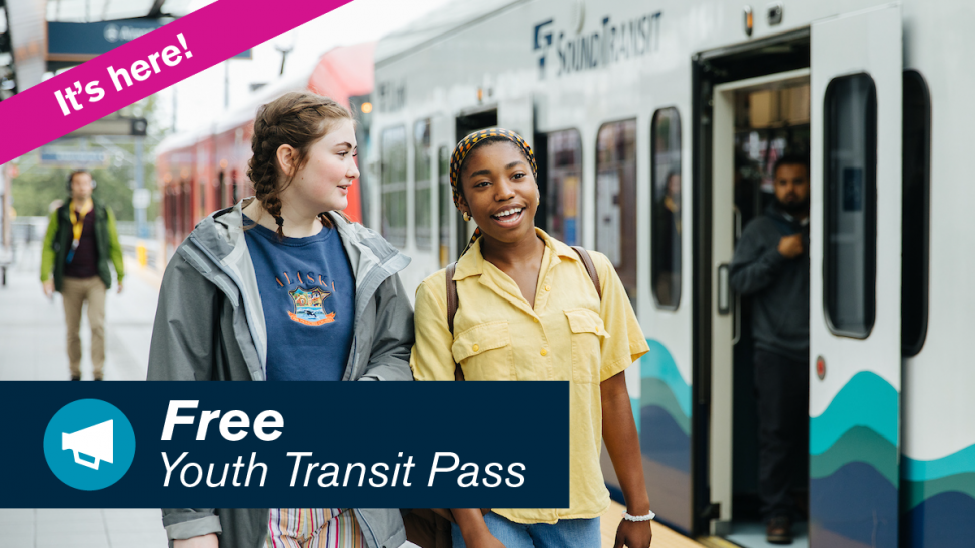 Two young people walk next to a Link train. Text reads: It's here! Free Youth Transit Pass.