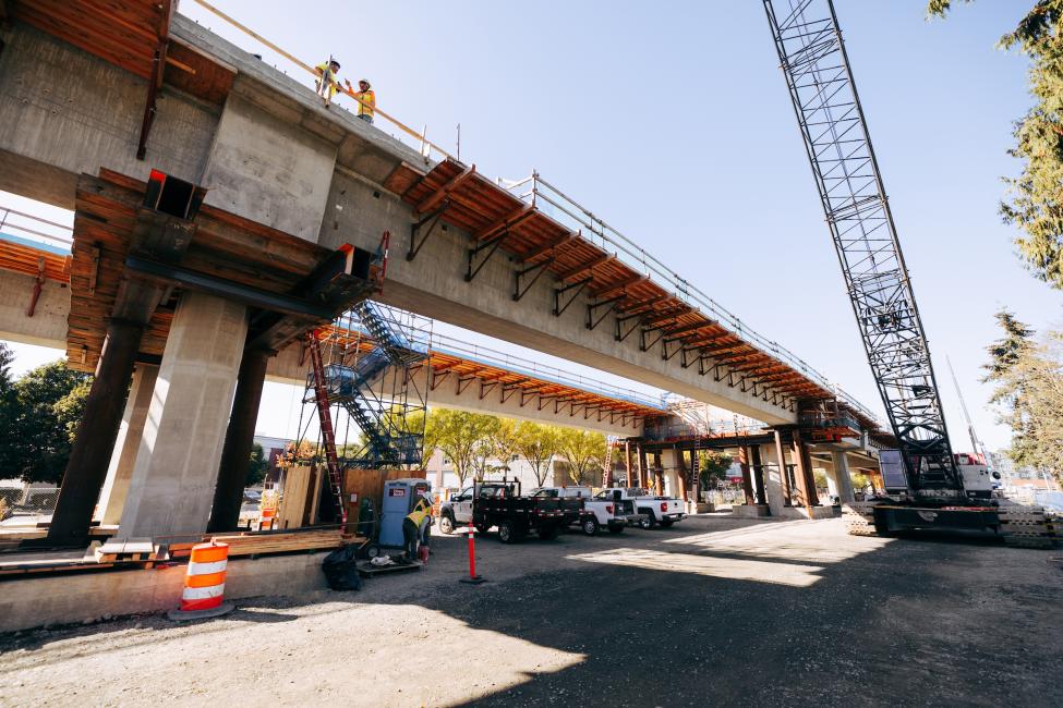 A view of an elevated guideway from street level. 