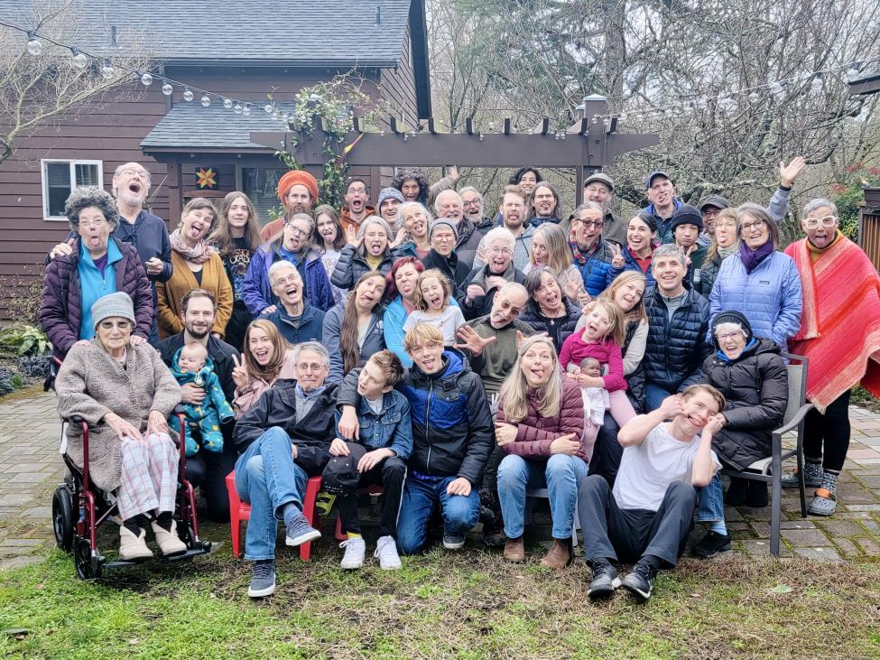 Denis in a large group photo with neighbors from Puget Ridge Cohousing