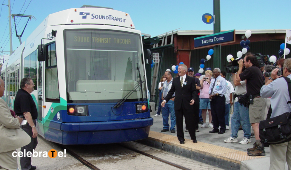 A crowd celebrates the opening of the T Line in 2003