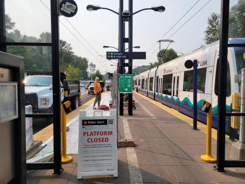 An A-board sign on a platform describes the current Link service disruption