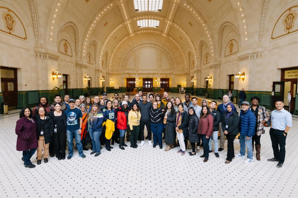 A large group photo with Doug Baldwin and Sound Transit employees in the Great Hall of Union Station in Seattle