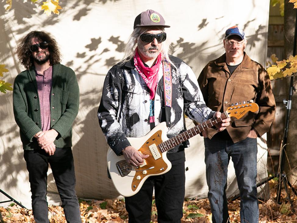 The band Dinosaur Jr poses with instruments 