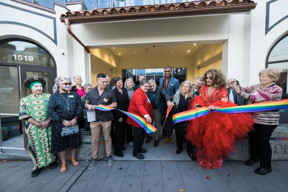 Community members gathered at a ribbon cutting for Pride Place.