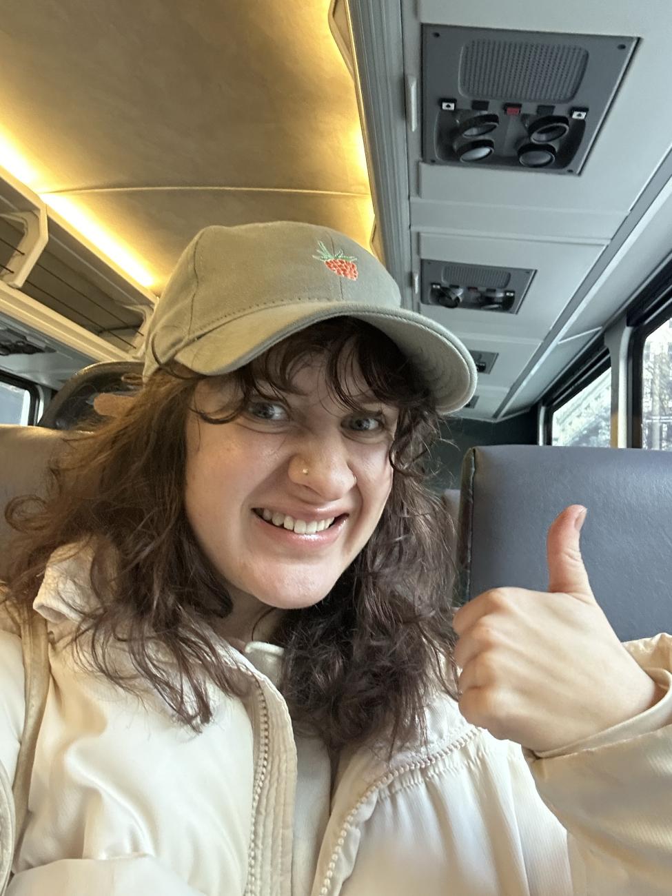 Hannah gives a thumbs up while taking a selfie on the Sounder train.