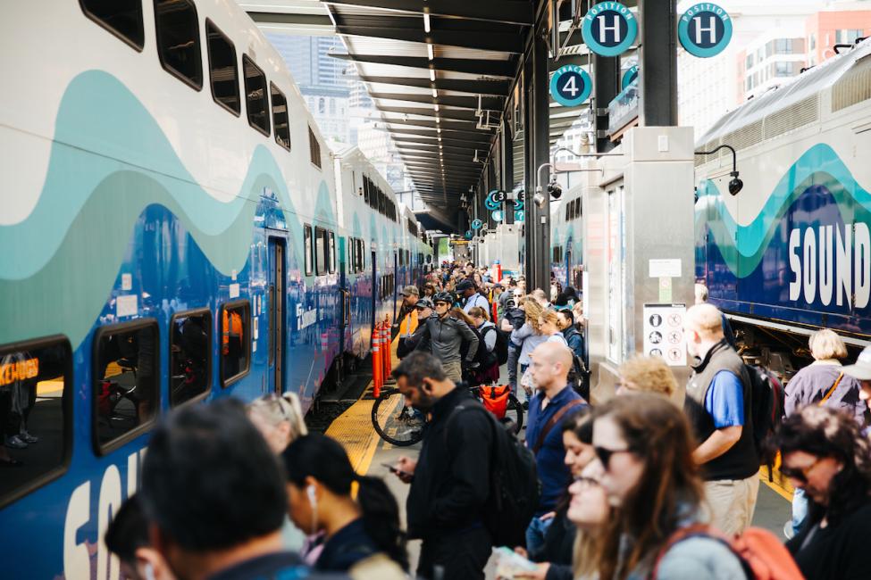 Passengers wait on the King Street Station platform for the Sounder train