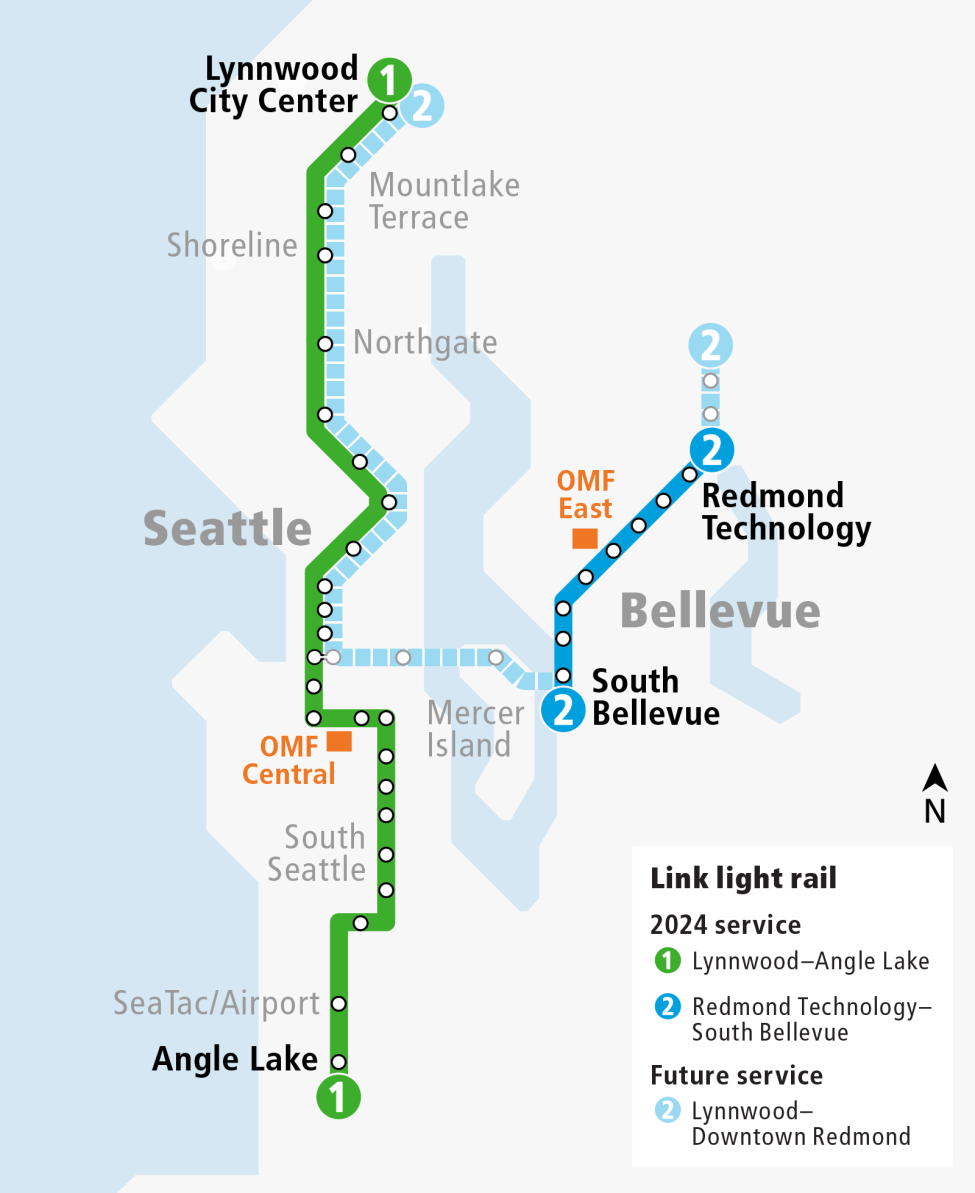 A map shows the 1 Line from Angle Lake to Lynnwood in green and the 2 Line from Lynnwood to Redmond in blue. It also shows the locations of the OMF Central in Seattle and the OMF East in Bellevue, where trains are maintained and stored.