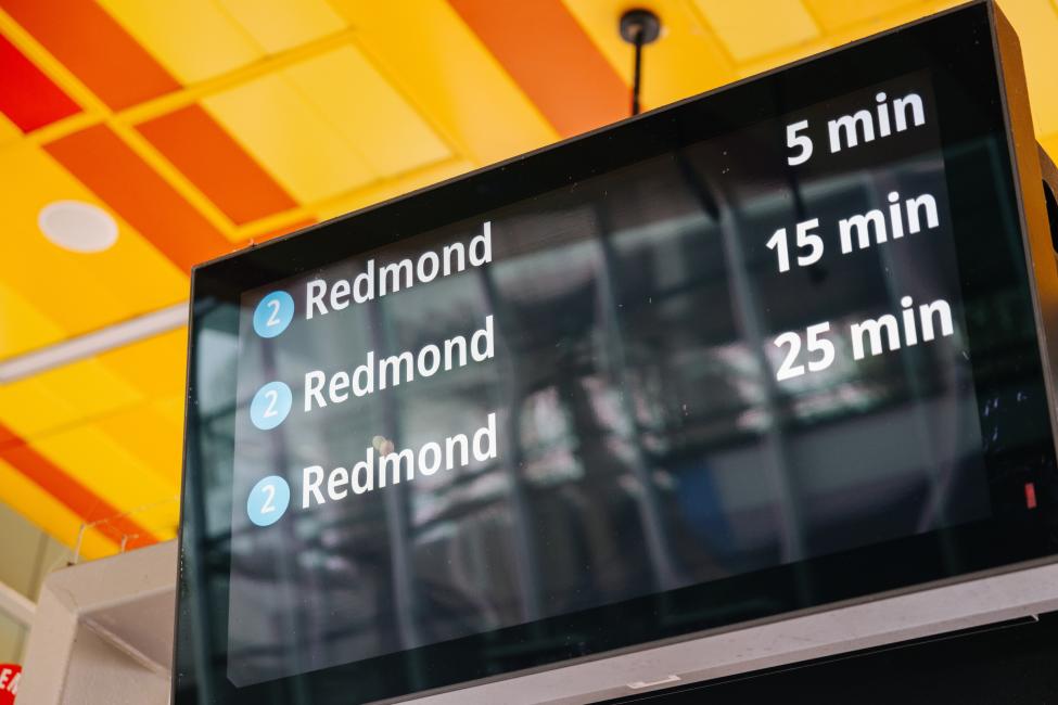 Digital signs at South Bellevue Station show train arrival times as 5 minutes, 15 minutes and 25 minutes
