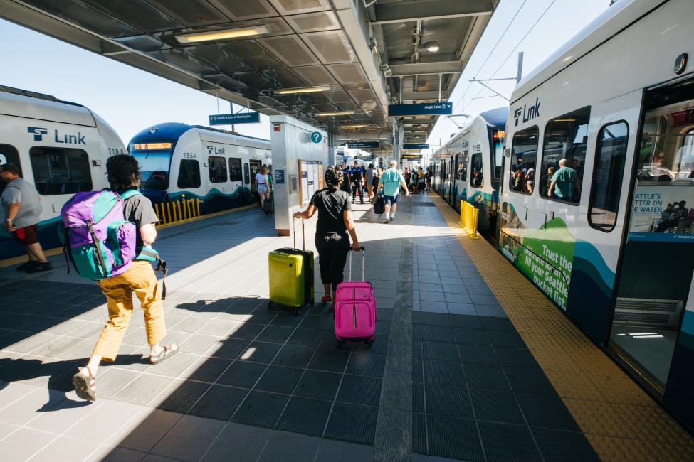 Passengers walk on the platform at SeaTac/Airport Station