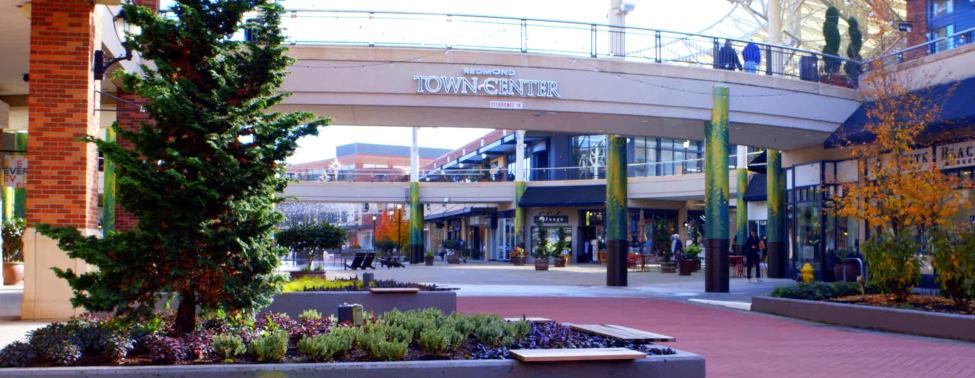 Signage at Redmond Town Center displayed over an empty plaza on a nice day