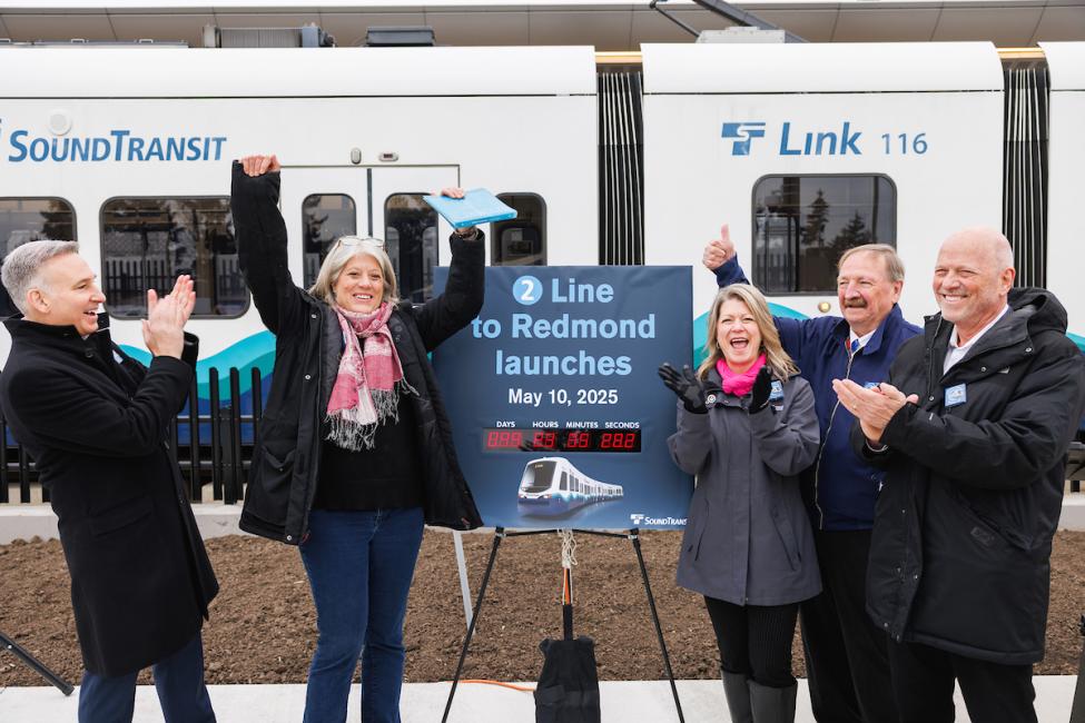 Elected officials unveil the countdown clock until the Downtown Redmond opening.