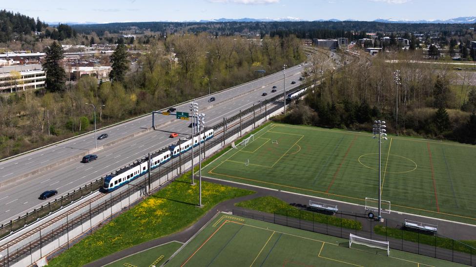 A two-car Link train on the tracks by Marymoor Park in Redmond