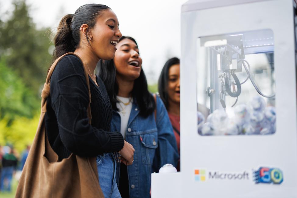 A passenger plays at the Microsoft claw machine
