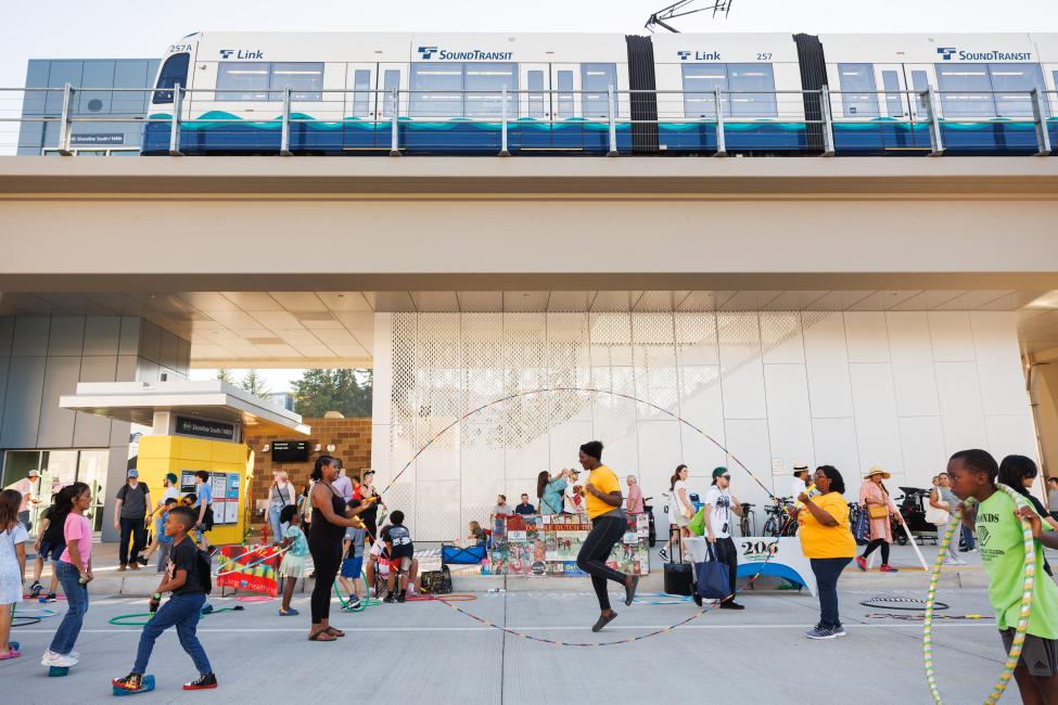 People gather and jump rope at the Lynnwood Link Extension opening celebration.