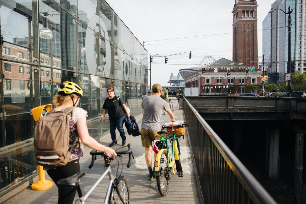 Sounder riders walk their bicycles to the street at King Street Station.