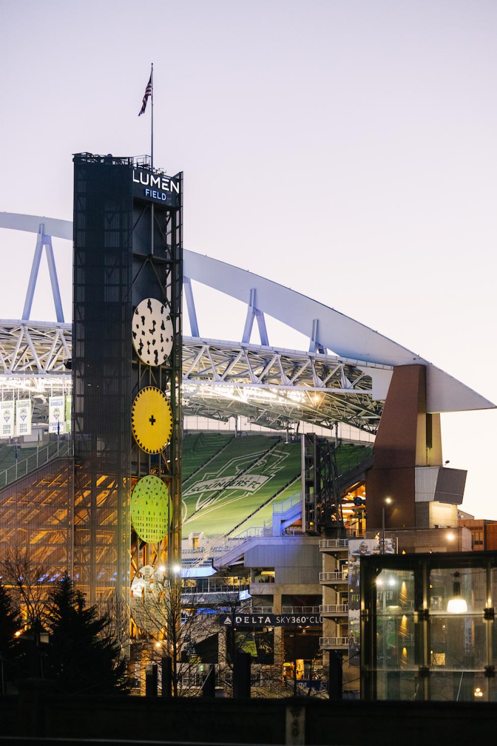 The north tower of Lumen Field at night