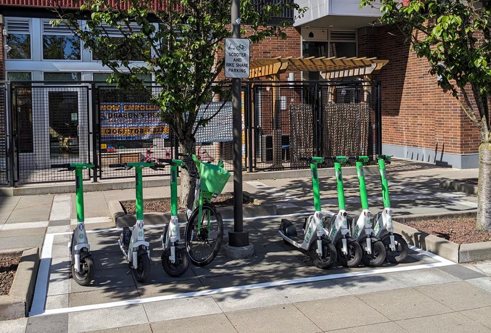 Shared bike parking area at Mount Baker Station with bikes parked in a rectangular area outlined by white paint.