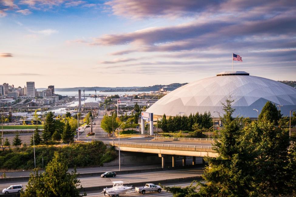 A picturesque silhouette of the Tacoma Dome on a partially cloudy day