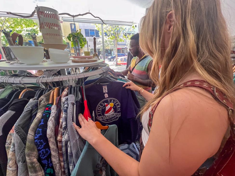 Photo of someone thrifting clothes