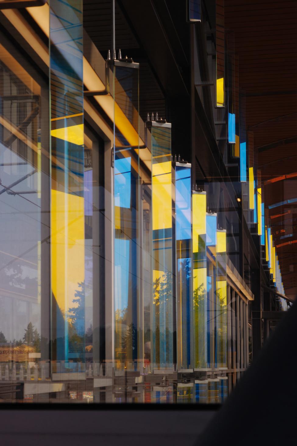 Public art seems to glow blue and yellow in the light at Federal Way Downtown Station