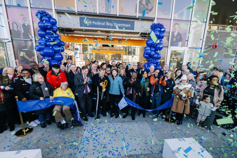 The ribbon is cut and confetti falls at the Federal Way opening