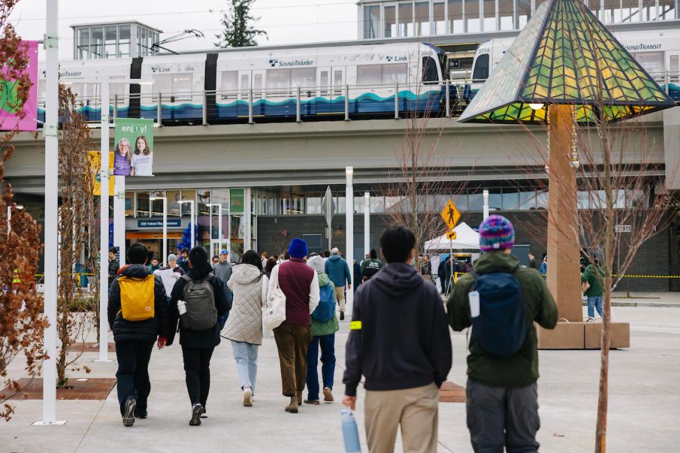 People walk around the plaza at Federal Way Downtown Station
