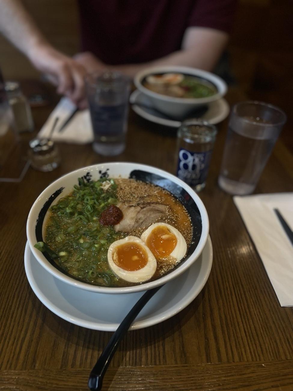 A bowl of ramen with a soft boiled egg