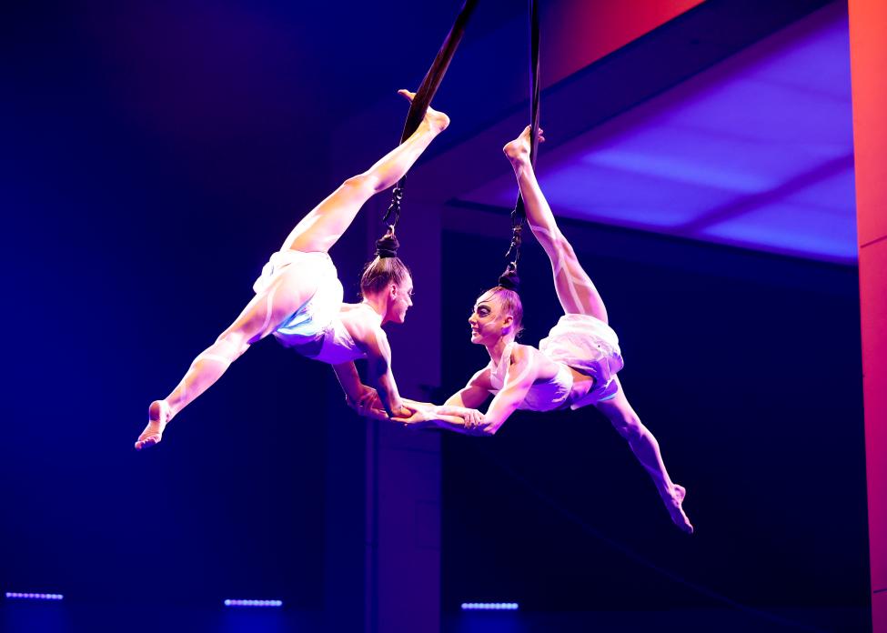 Two aerialists perform as part of the 'Echo' show.