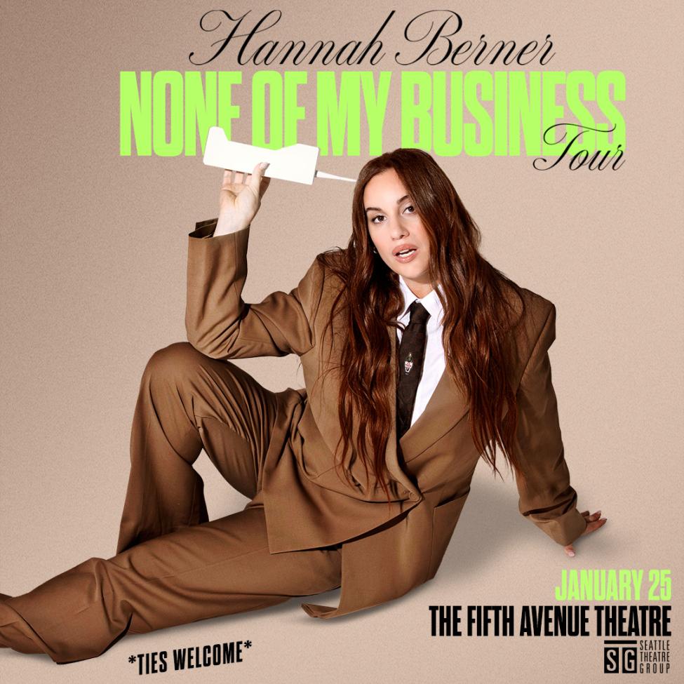 Hannah berner lays down in a suit promoting her new comedy tour