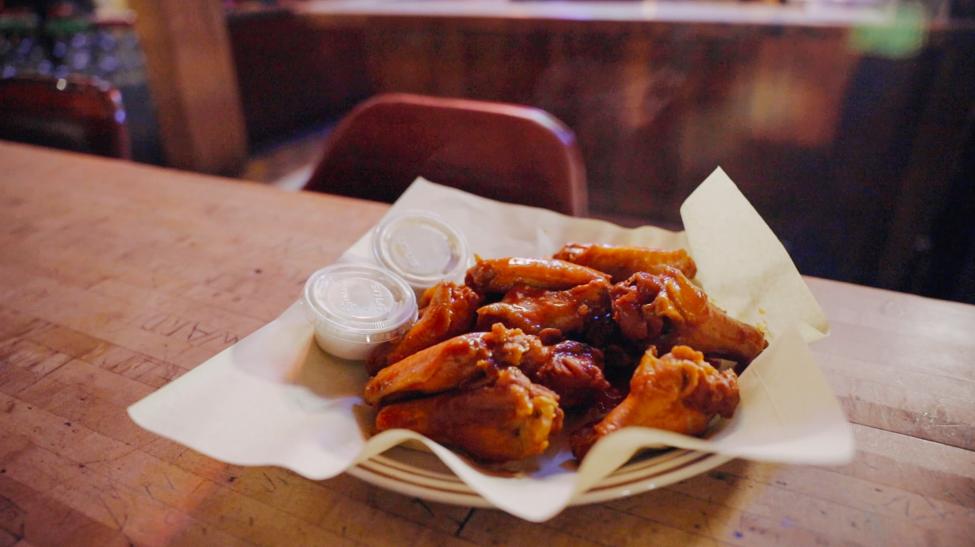 A plate of chicken wings on a table