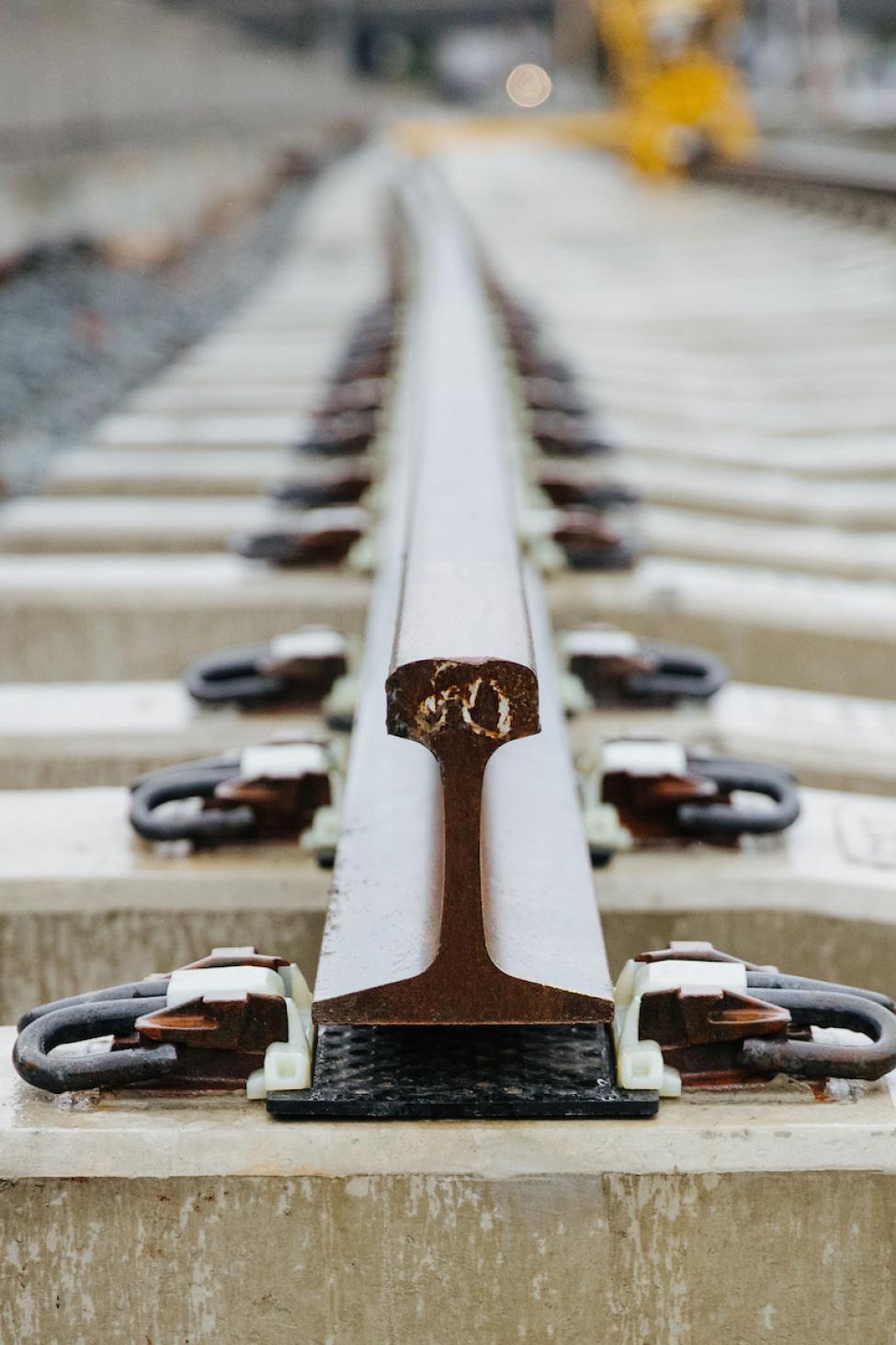 A close up of rail on top of concrete blocks 