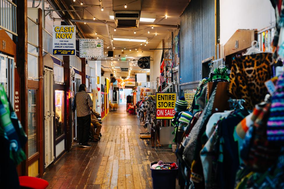 A hallway with retail shops on either side in Freighthouse Square